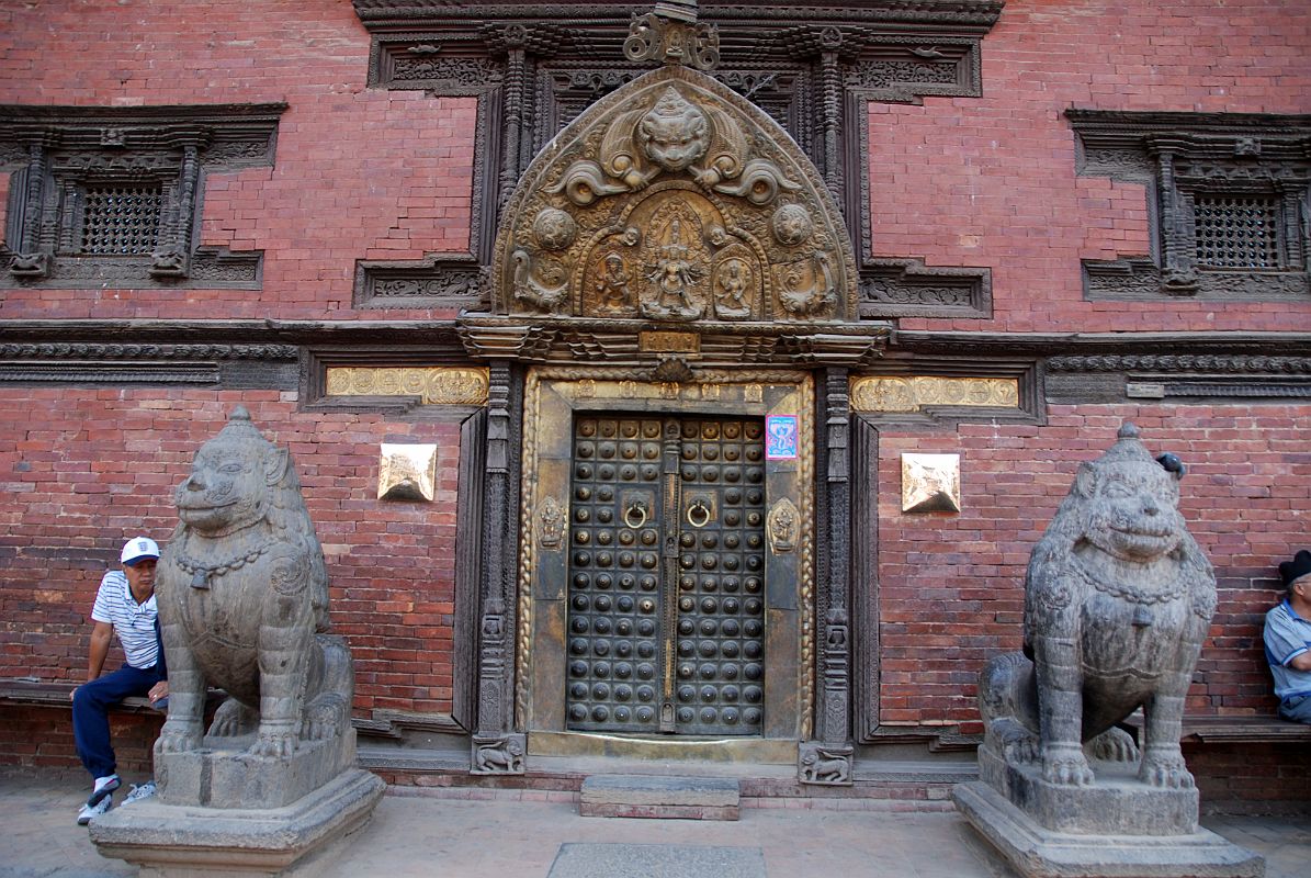 Kathmandu Patan Durbar Square 15 Two Snow Lions Guard The Golden Gate Sun Dhoka Entrance Doors to Patan Museum With the Gilded Torana Above 